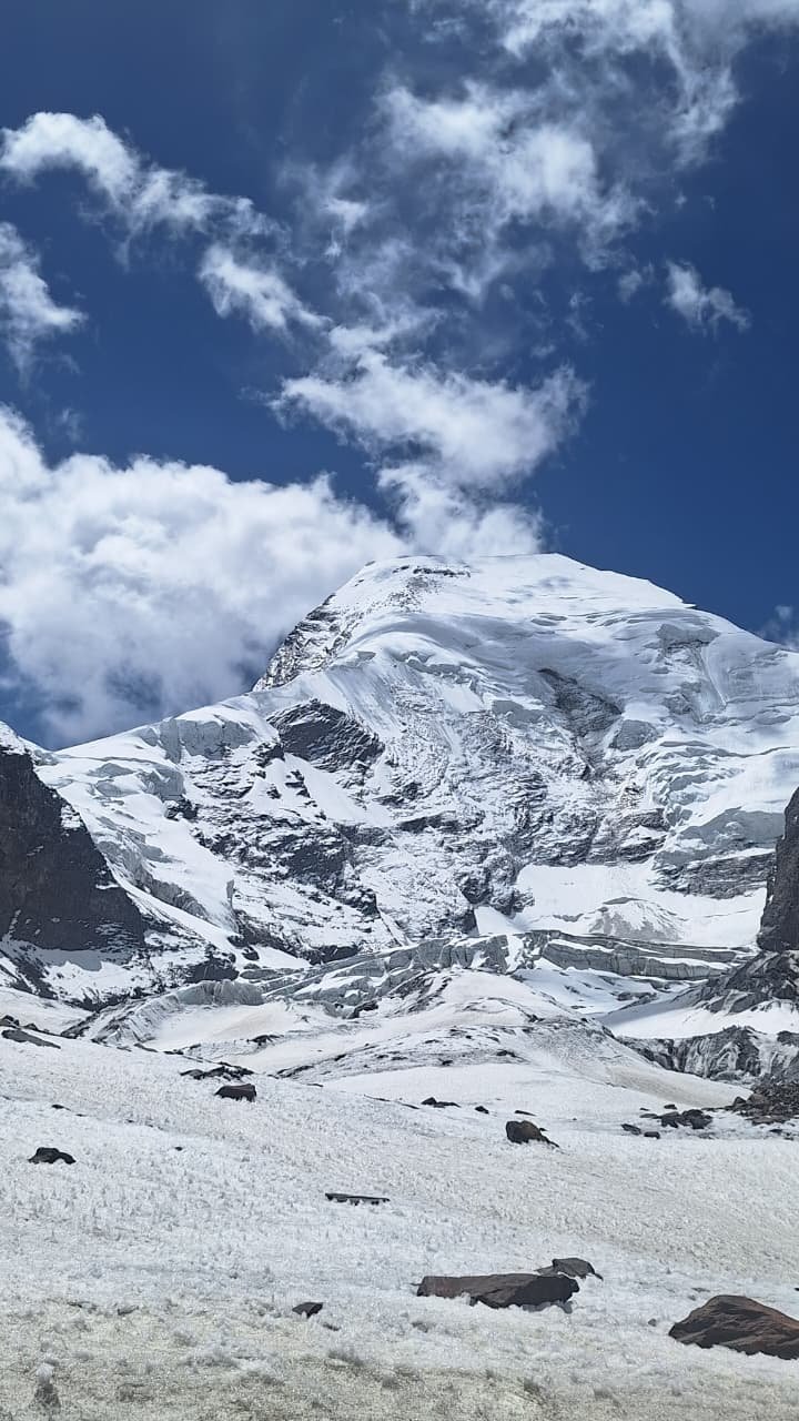Snow-covered Himalayan mountain above a glacier