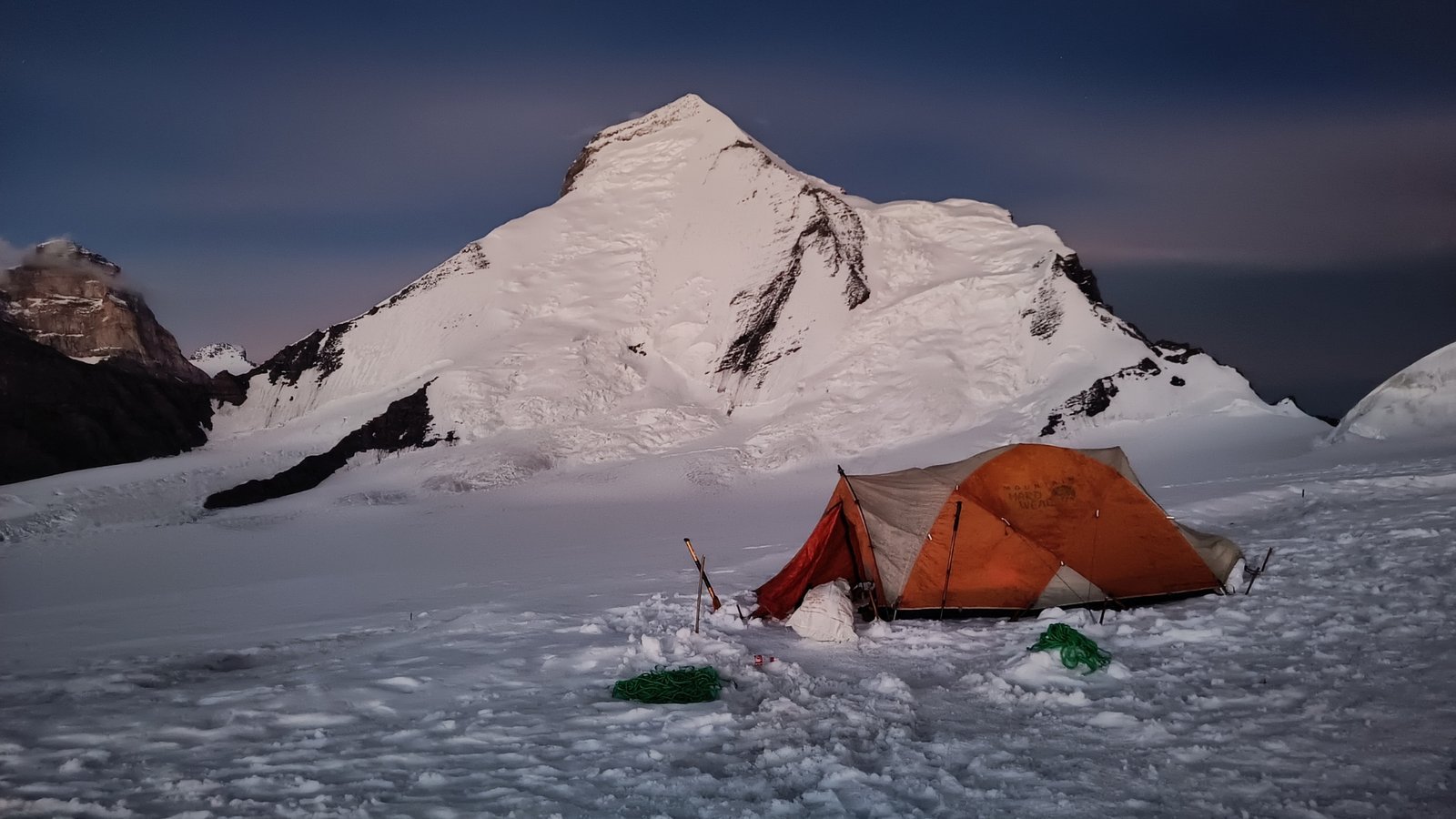 Expedition tent on snow beneath Mt. Nun